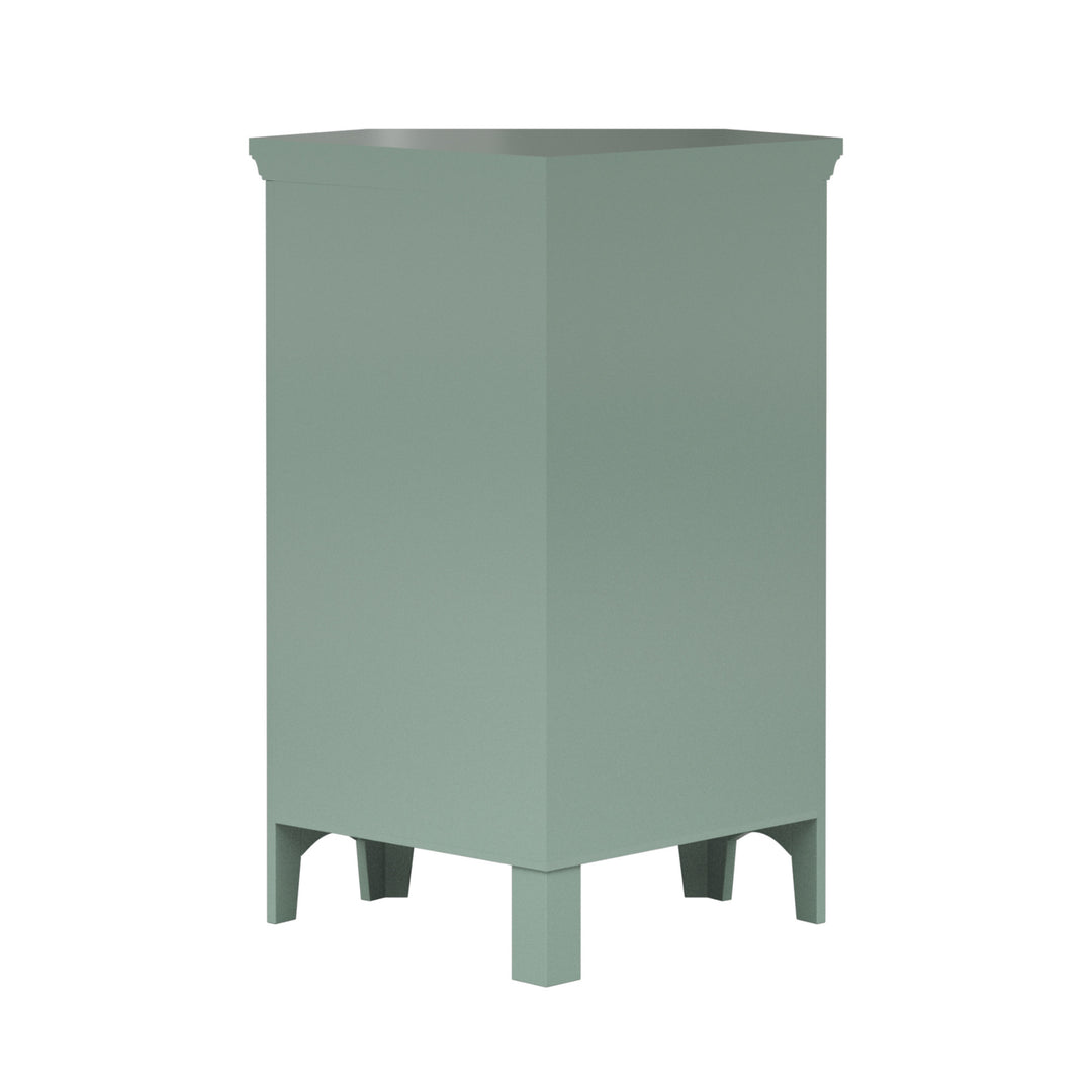 A back view of a sage green corner floor cabinet.