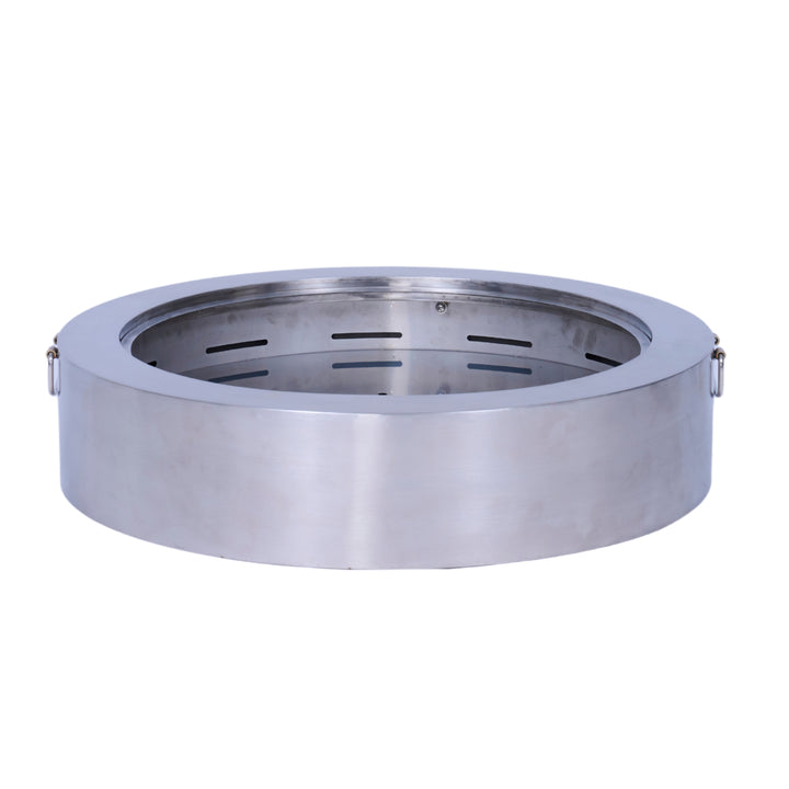 A round stainless steel fire pit with ventilation slits and side handles.