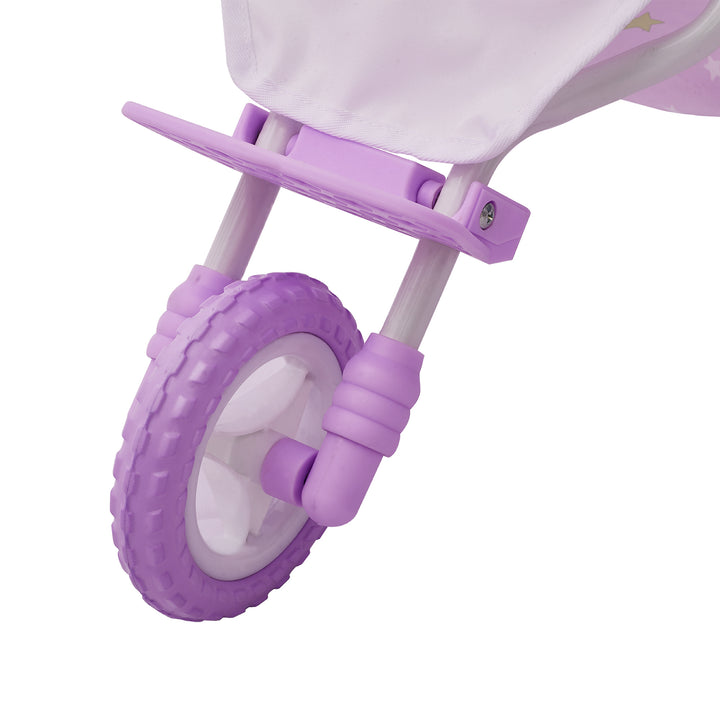 Close-up of a purple all-terrain wheel on a purple with white stars baby doll jogging stroller with purple wheels and a white frame.