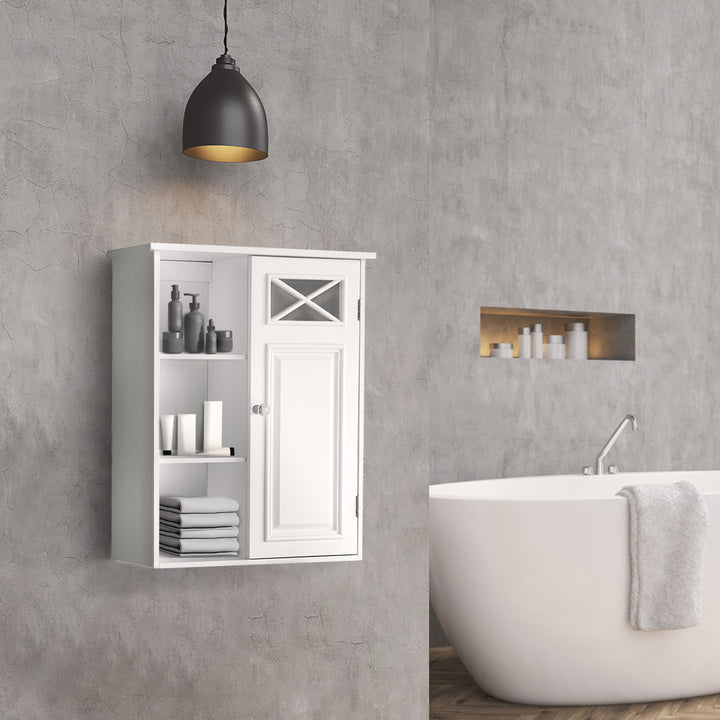 Teamson Home Dawson Removable Wooden Wall Cabinet with Cross Molding, White, hung on a gray wall in a modern bathroom with toiletries and towels on the open shelves